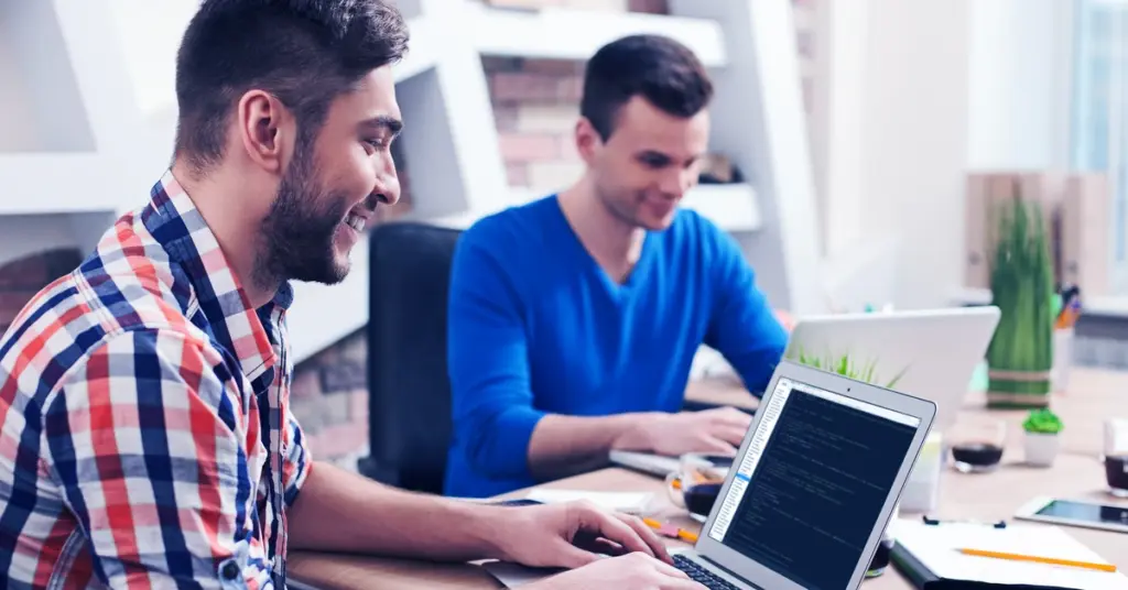 IT engineers with laptops in a server room — register Fortinet service contracts and FortiCare subscriptions promptly to avoid grace period auto-start