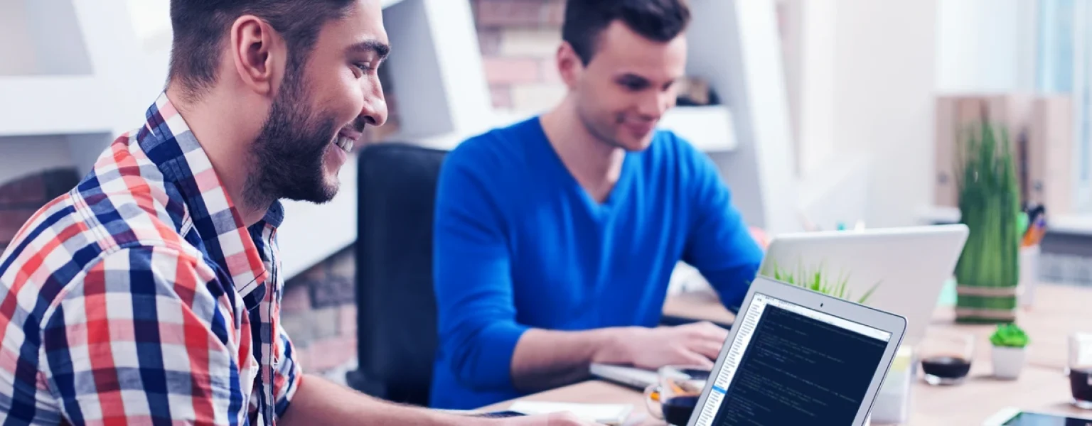 IT engineers with laptops in a server room — register Fortinet service contracts and FortiCare subscriptions promptly to avoid grace period auto-start